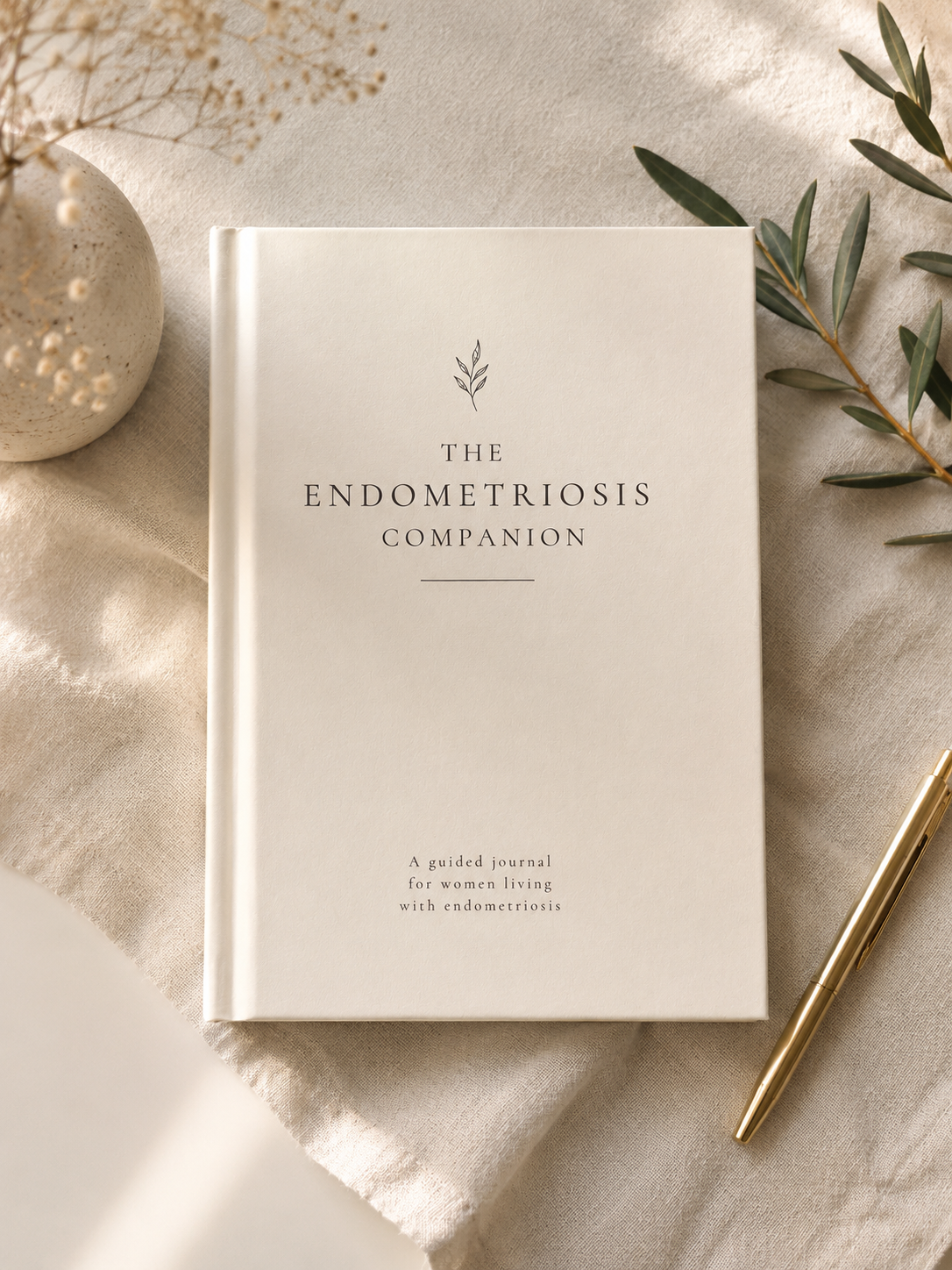 The Endometriosis Companion endometriosis journal in stone with gold pen